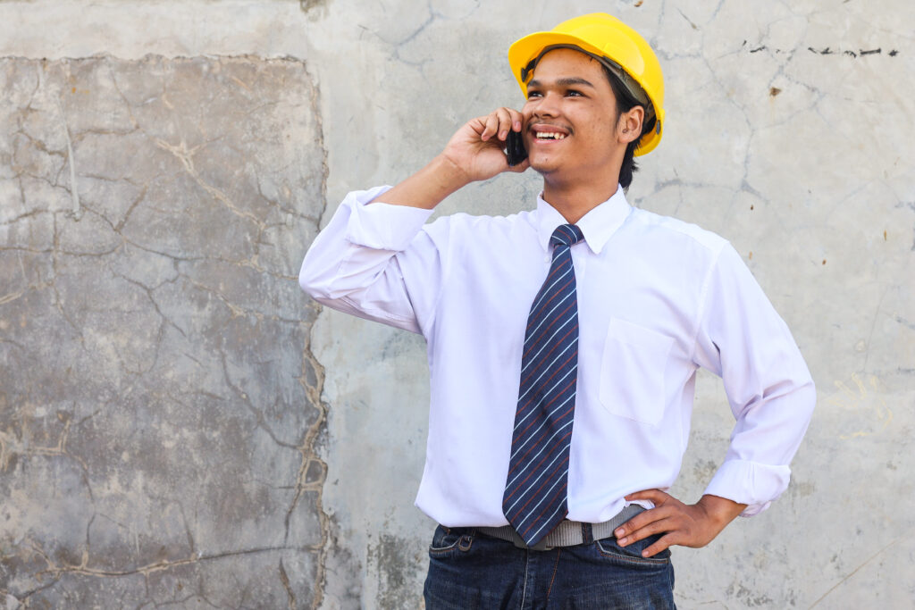 concrete contractor talking on the phone